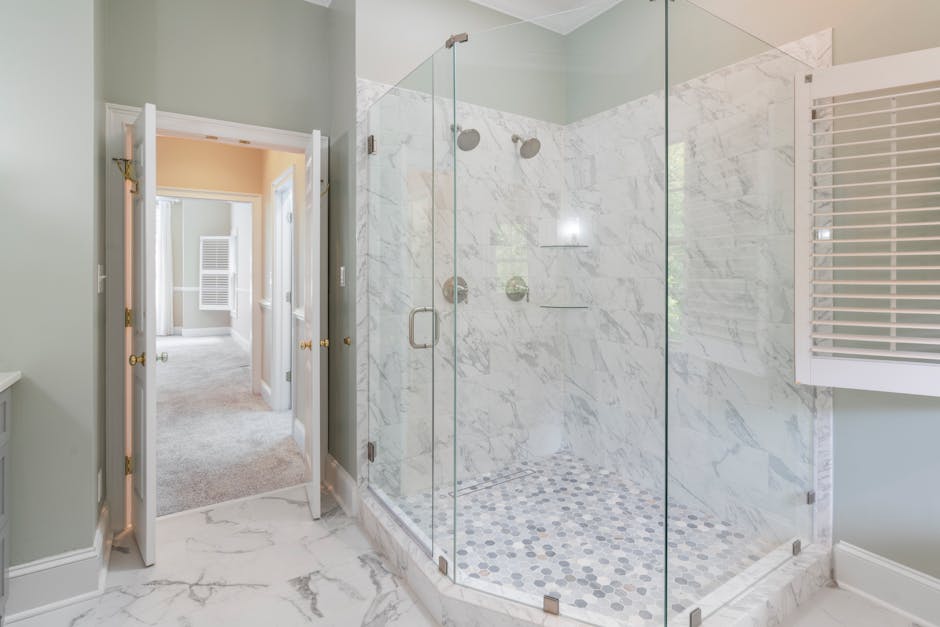 Professional contractor measuring for a bathroom remodel